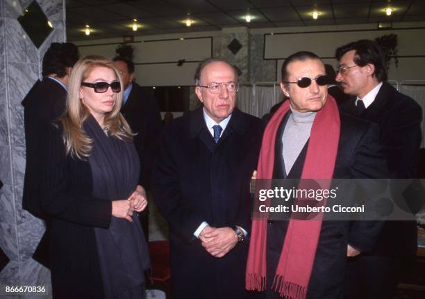 Fedele Confalonieri, the Italian singer Tony Renis and Silvio Berlusconi's wife Veronica Lario at the funeral chamber of the military hospital in...