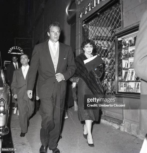 The American actor Charlton Heston walking in Via Veneto with his wife Lydia Marie Clarke in September 1958.