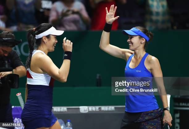 Chan Yung-Jan of Chinese Taipei and Martina Hingis of Switzerland celebrate victory in their doubles match against Kveta Peschke of Czech Republic...