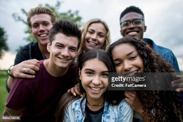 group of teens - group of kids stock pictures, royalty-free photos & images
