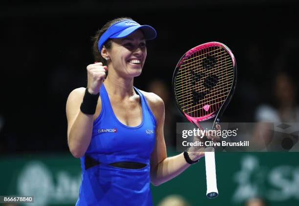 Martina Hingis of Switzerland partnering Chan Yung-Jan of Chinese Taipei celebrates victory in their doubles match against Kveta Peschke of Czech...