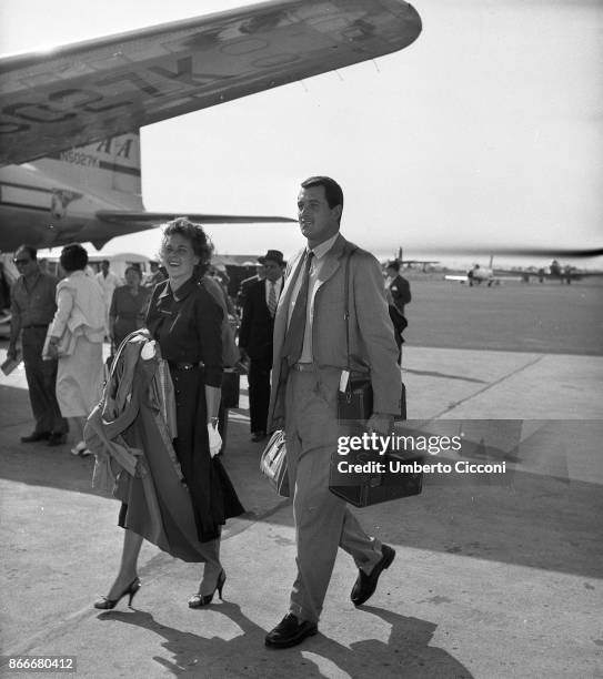 American actor Rock Hudson arrives in Ciampino airport in Rome with his wife in June 1956.