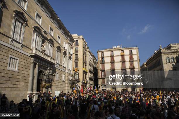 Students wave Catalan pro-independence flags outside the Generalitat regional government offices at Sant Jaume after a demonstration protesting the...