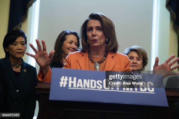 House Minority Leader Nancy Pelosi speaks as Rep. Judy Chu , Rep. Diana DeGette and Rep. Louise Slaughter listen during a news conference October 26,...