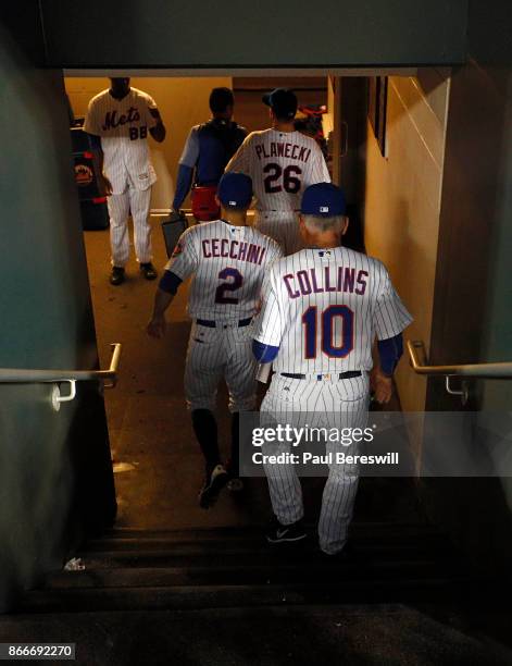 Manager Terry Collins of the New York Mets follows the team out of the dugout and down the tunnel to the dressing room after the Mets last home game...