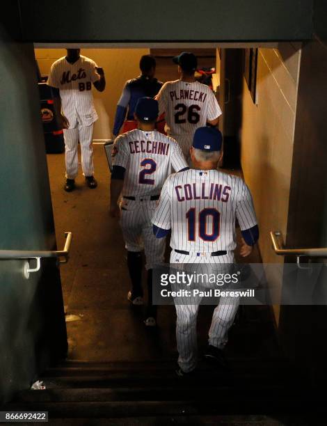 Manager Terry Collins of the New York Mets follows the team out of the dugout and down the tunnel to the dressing room after the Mets last home game...