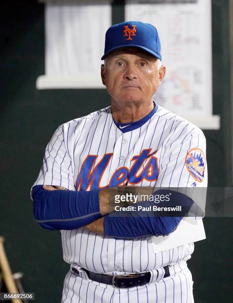 Manager Terry Collins of the New York Mets looks out from the dugout before managing the Mets last home game of the season in an MLB baseball game...