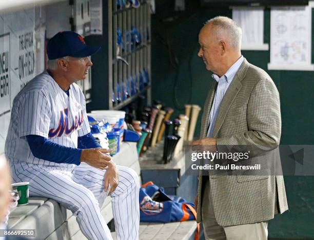 Manager Terry Collins of the New York Mets and General Manager Sandy Alderson have a talk in the dugout before the Mets played their last home game...