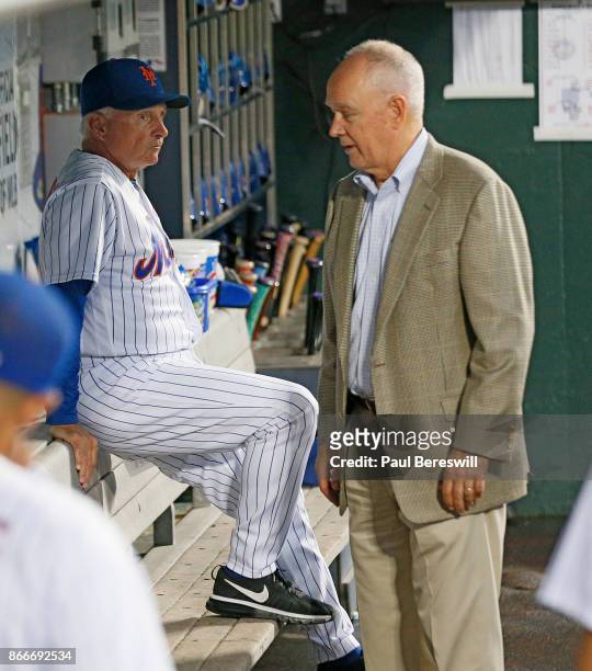 Manager Terry Collins of the New York Mets and General Manager Sandy Alderson have a talk in the dugout before the Mets played their last home game...
