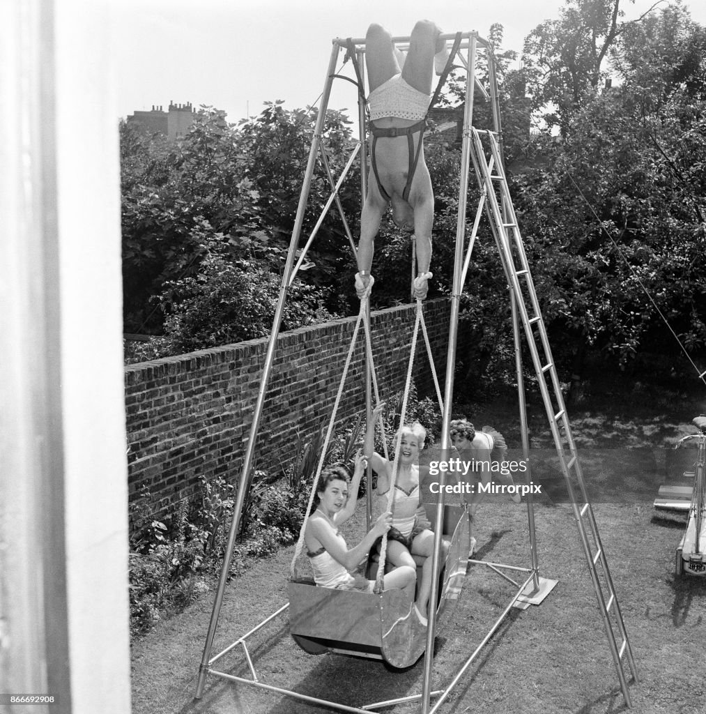 Strong man swings a swing boat