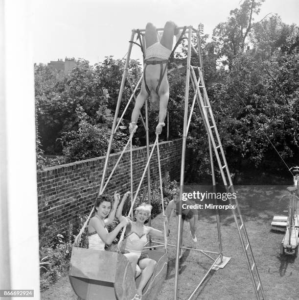 Novelty acrobatic machine has been devised by 'The Amazing Briton and his West End Lovelies'. It is a human swing boat which will be shown for the...