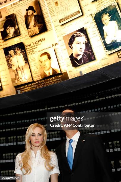 The United States Secretary of the Treasury Steven Mnuchin and his wife Louise Linton look at pictures of Jewish Holocaust victims at the Hall of...