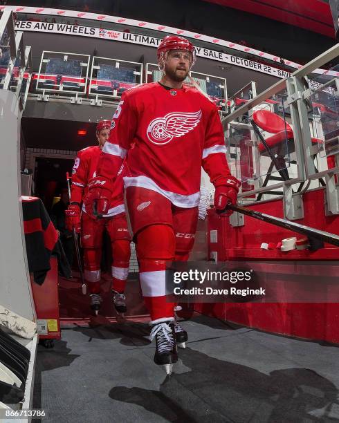 Mike Green of the Detroit Red Wings walks out to the ice for warm ups before an NHL game against the Washington Capitals at Little Caesars Arena on...