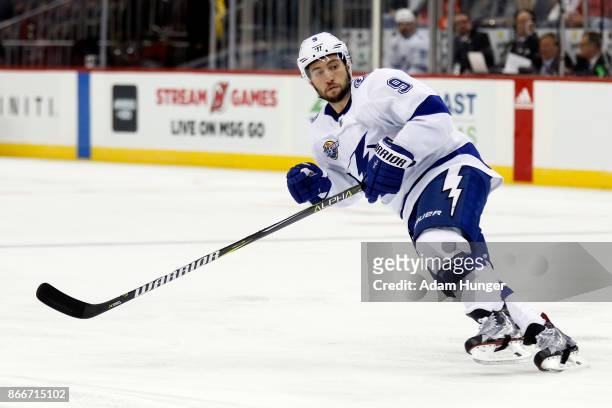 Tyler Johnson of the Tampa Bay Lightning in action against the New Jersey Devils during the first period at the Prudential Center on October 17, 2017...