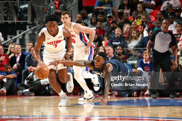 Jeff Teague of the Minnesota Timberwolves dives for the ball against Stanley Johnson of the Detroit Pistons on October 25, 2017 at Little Caesars...