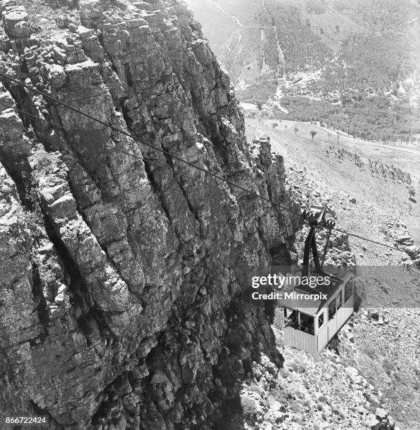 The cable car carrying tourist to the summit of Table Mountain which over looks Cape Town, 4th February 1955.