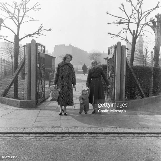 Mother, Grandmother and child seen here walking in an un-named East London Park, 3rd March 1955.