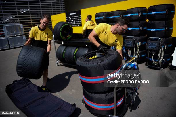Renault team's mechanics prepare tires for the Formula One Grand Prix of Mexico at Autodromo Hermanos Rodriguez on October 26, 2017 in Mexico City. /...