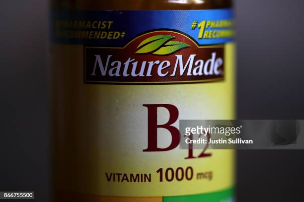 Bottle of vitamins B12 pills is displayed on October 26, 2017 in San Anselmo, California. According to a report in the Journal of Clinical Oncology,...