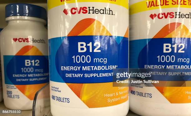 Bottles of vitamin B12 are displayed on a shelf at a CVS store on October 26, 2017 in San Anselmo, California. According to a report in the Journal...
