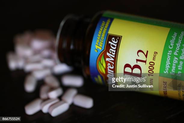 Bottle of vitamins B12 pills is displayed on October 26, 2017 in San Anselmo, California. According to a report in the Journal of Clinical Oncology,...