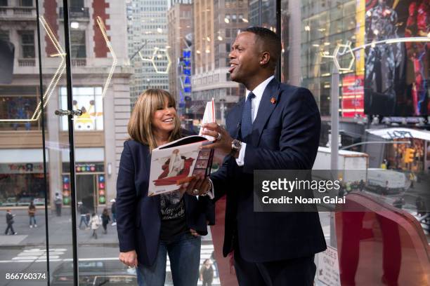 Melissa Rivers and A. J. Calloway visit "Extra" at H&M Times Square on October 26, 2017 in New York City.