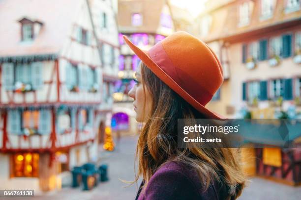 young woman enjoying christmas in colmar, france - strasbourg winter stock pictures, royalty-free photos & images