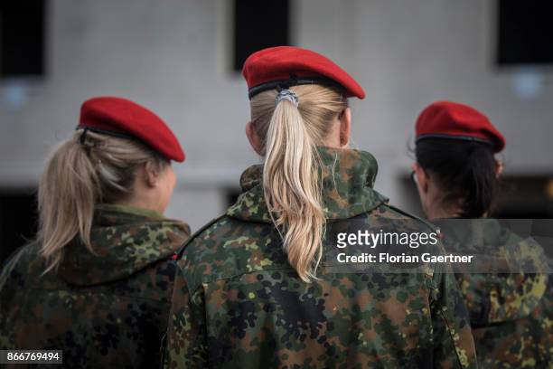 Female soldiers are pictured from behind on October 26, 2017 in Schnoeggersburg, Germany.