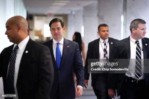 Senate Intelligence Committee member Sen. Marco Rubio is flanked by plain-clothed U.S. Capitol Police as he arrives for a classified hearing at the...