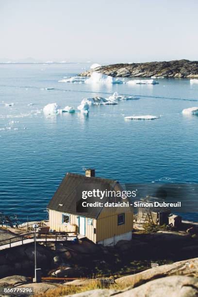 icebergs and wooden house in ilulissat, disko bay - disko bay stock pictures, royalty-free photos & images