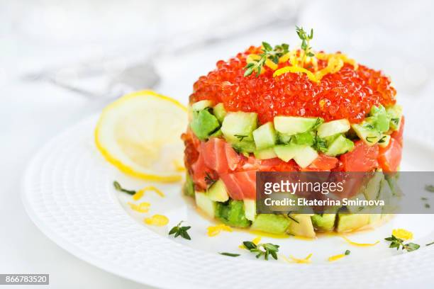 delicious red caviar, salmon, avocado and cucumber tartar - biff tartar bildbanksfoton och bilder