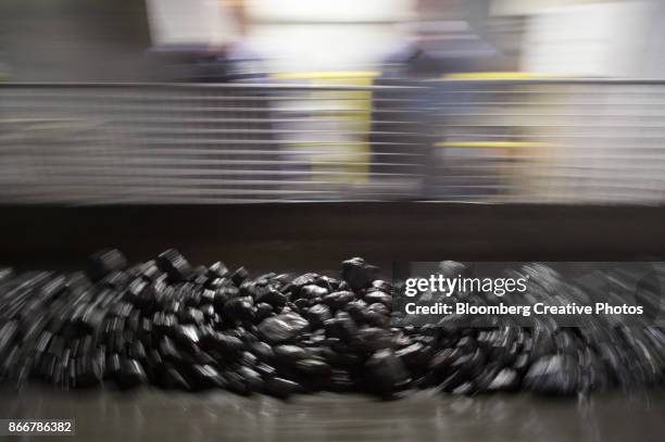 copper-nickel ore moves along a conveyor belt at a concentrator plant - norilsk stock pictures, royalty-free photos & images