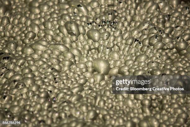 copper flotation foam bubbles inside a machine at a concentrator plant - copper concentrator stock pictures, royalty-free photos & images