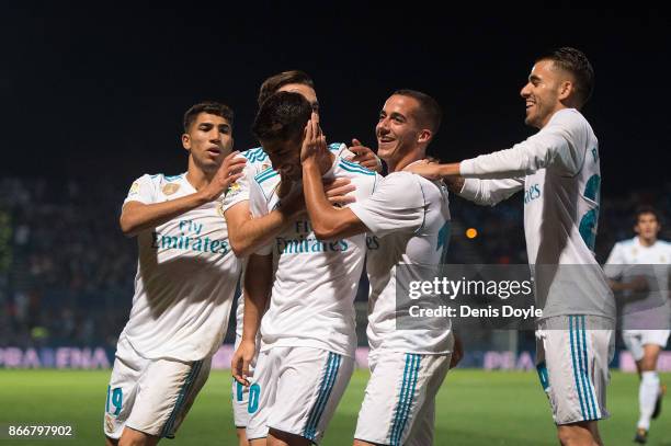 Marco Asensio of Real Madrid CF celebrates with teammates after scoring his teamÕs opening goal from a penalty kick during the Copa del Rey, Round of...