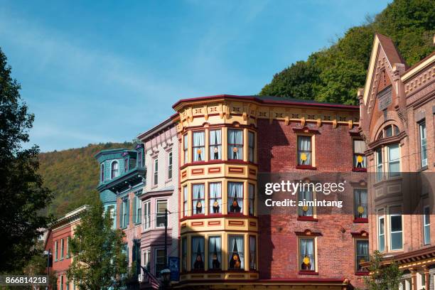 colorful historic buildings on broadway street in downtown jim thorpe - jim thorpe pennsylvania stock pictures, royalty-free photos & images