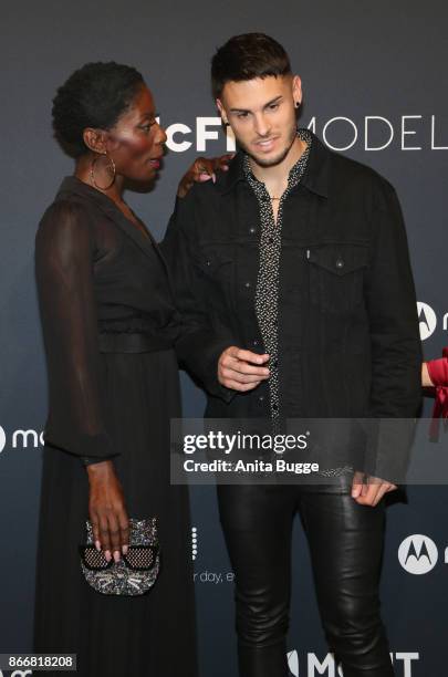 Nikeata Thompson and Baptiste Giabiconi attend the 'New Body Award by McFit Models' at Tempodrom on October 26, 2017 in Berlin, Germany.