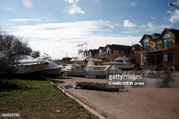 Boats lie on a street after Hurricane Sandy affected the section of Eltingville in Staten Island New York on November 02,2012.