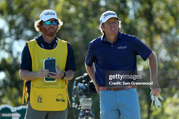 Derek Fathauer talks with his caddie on the 13th hole during the First Round of the Sanderson Farms Championship at the Country Club of Jackson on...