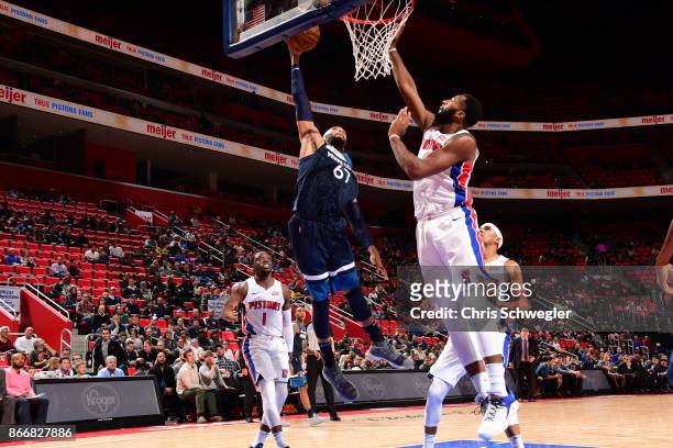 Taj Gibson of the Minnesota Timberwolves drives to the basket against the Detroit Pistons on October 25, 2017 at Little Caesars Arena in Detroit,...
