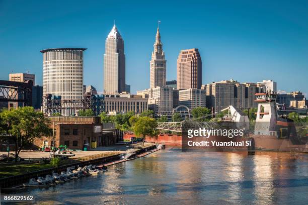 cleveland skyline with an vessel - cleveland ohio stock pictures, royalty-free photos & images