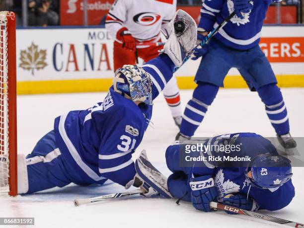 Toronto Maple Leafs goalie Frederik Andersen makes a great grab as Toronto Maple Leafs center Nazem Kadri slides into him. Toronto Maple Leafs VS...