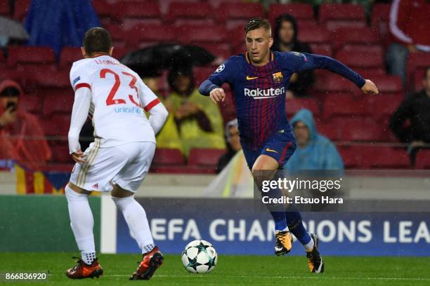 Gerard Deulofeu of Barcelona takes on Leonardo Koutris of Olympicakos during the UEFA Champions League group D match between FC Barcelona and...