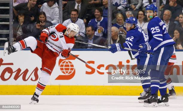 Toronto Maple Leafs center Tyler Bozak manages to tie up Carolina Hurricanes left wing Jeff Skinner and not get a penalty. Toronto Maple Leafs VS...