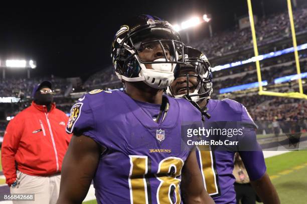 Wide Receiver Jeremy Maclin and wide receiver Breshad Perriman of the Baltimore Ravens celebrate after a first quarter touchdown against the Miami...