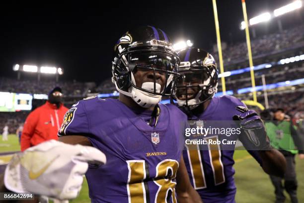 Wide Receiver Jeremy Maclin and wide receiver Breshad Perriman of the Baltimore Ravens celebrate after a first quarter touchdown against the Miami...