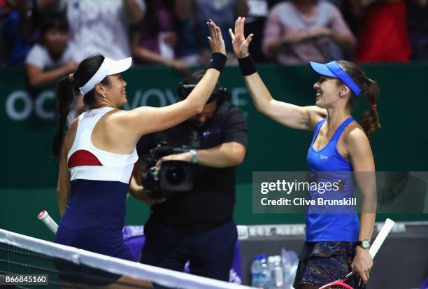 Chan Yung-Jan of Chinese Taipei and Martina Hingis of Switzerland celebrate victory in their doubles match against Kveta Peschke of Czech Republic...