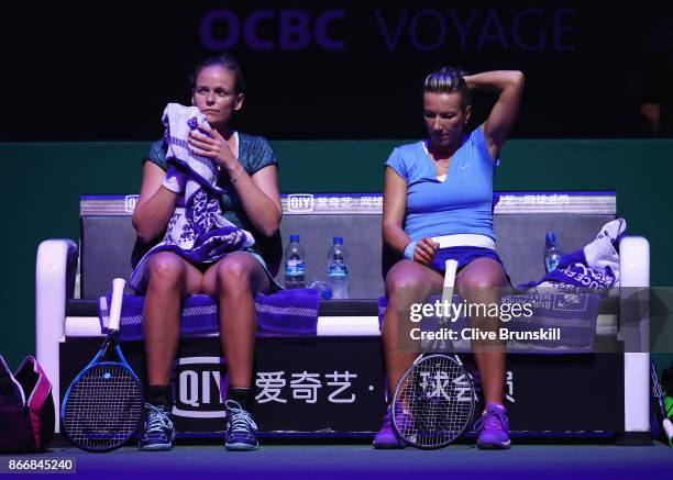 Anna-Lena Groenefeld of Germany and Kveta Peschke of Czech Republic look dejected in their doubles match against Martina Hingis of Switzerland and...