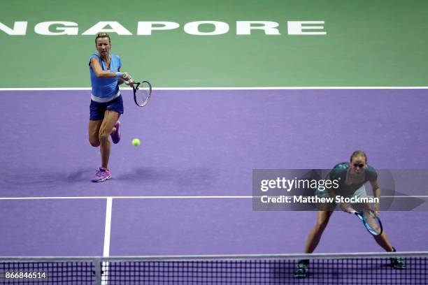 Kveta Peschke of Czech Republic and Anna-Lena Groenefeld of Germany in action in their doubles match against Martina Hingis of Switzerland and Chan...