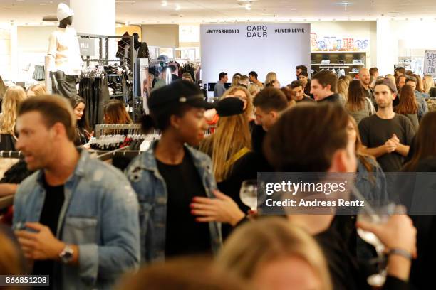 Guests attend the 'Caro Daur x Levi's' event at Peek & Cloppenburg Weltstadthaus on October 26, 2017 in Duesseldorf, Germany.