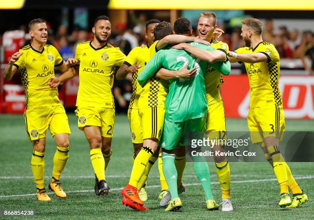 Adam Jahn of Columbus Crew reacts with goalkeeper Zack Steffen after converting a penalty kick to give the Crew a win over the Atlanta United 3-1 on...